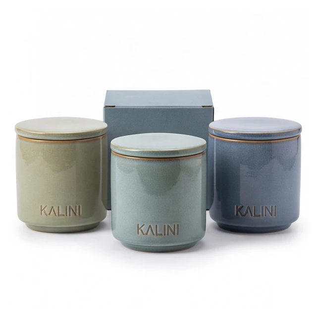 Green and blue ceramic jars with lids and a blue-gray box