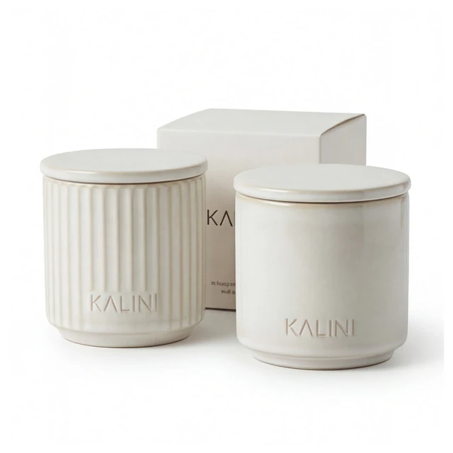Ivory ceramic jars in fluted and smooth forms with lids