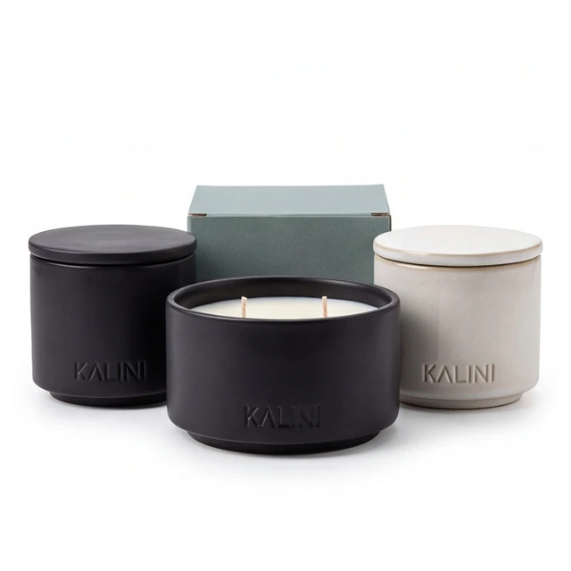 Black ceramic candle bowl with dark and ivory jars