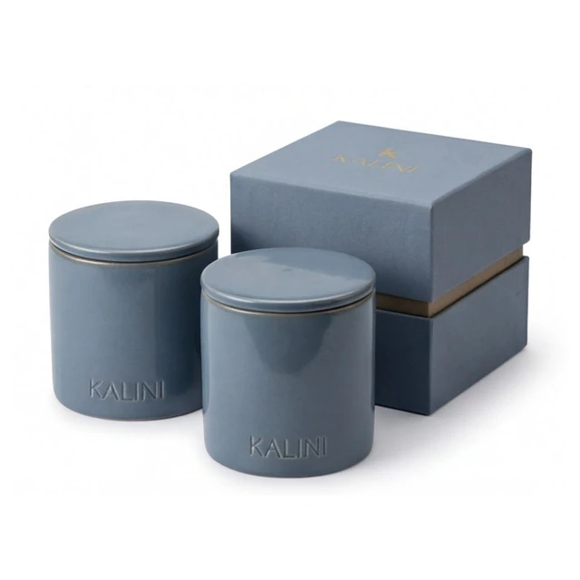 Blue round ceramic candle jars with lids and a blue box