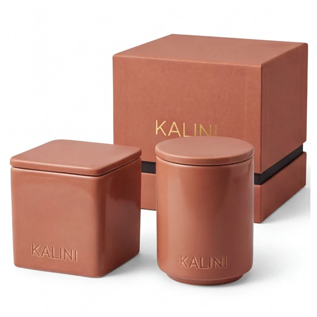 Terracotta-color square and round ceramic candle jars with a matching-color box