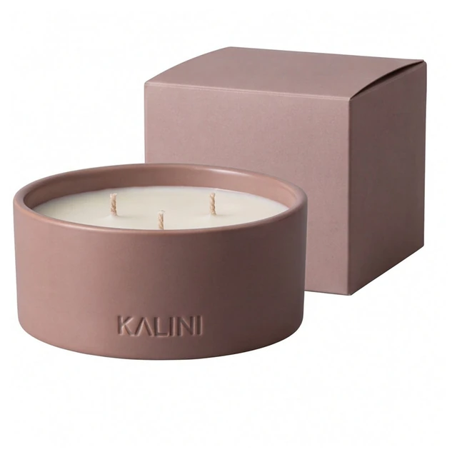 Low pink ceramic candle bowl beside a matching-color presentation box