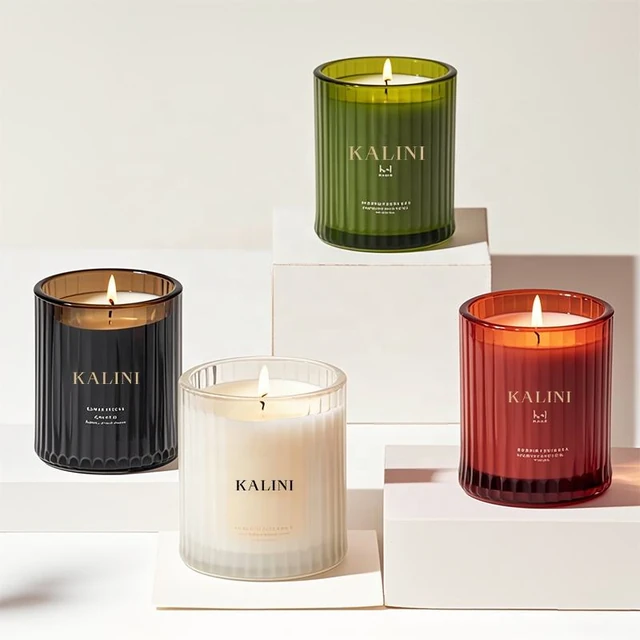 Colored fluted glass candle jars arranged on display blocks