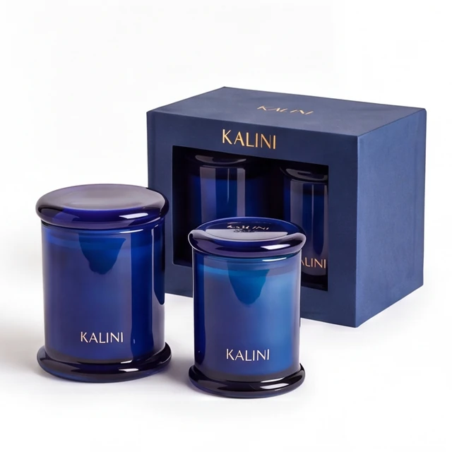 Navy spool-shaped glass candle jar presentation