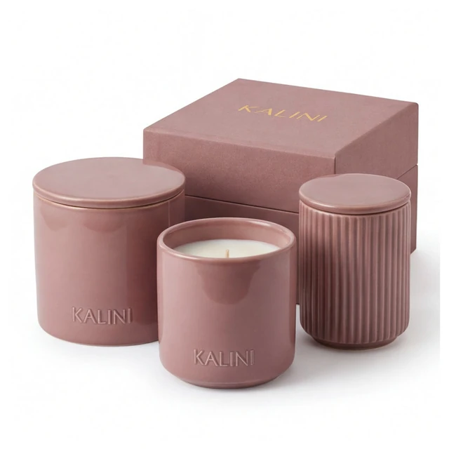 Pink ceramic jars in round and fluted forms beside a box