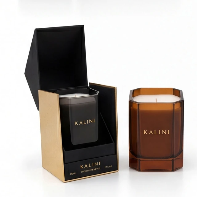 Smoke and amber faceted glass candle jars with an open black and gold box
